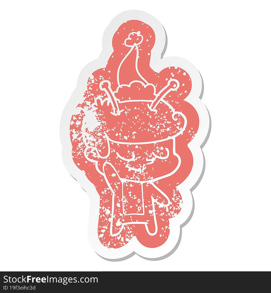 friendly cartoon distressed sticker of a spaceman wearing santa hat