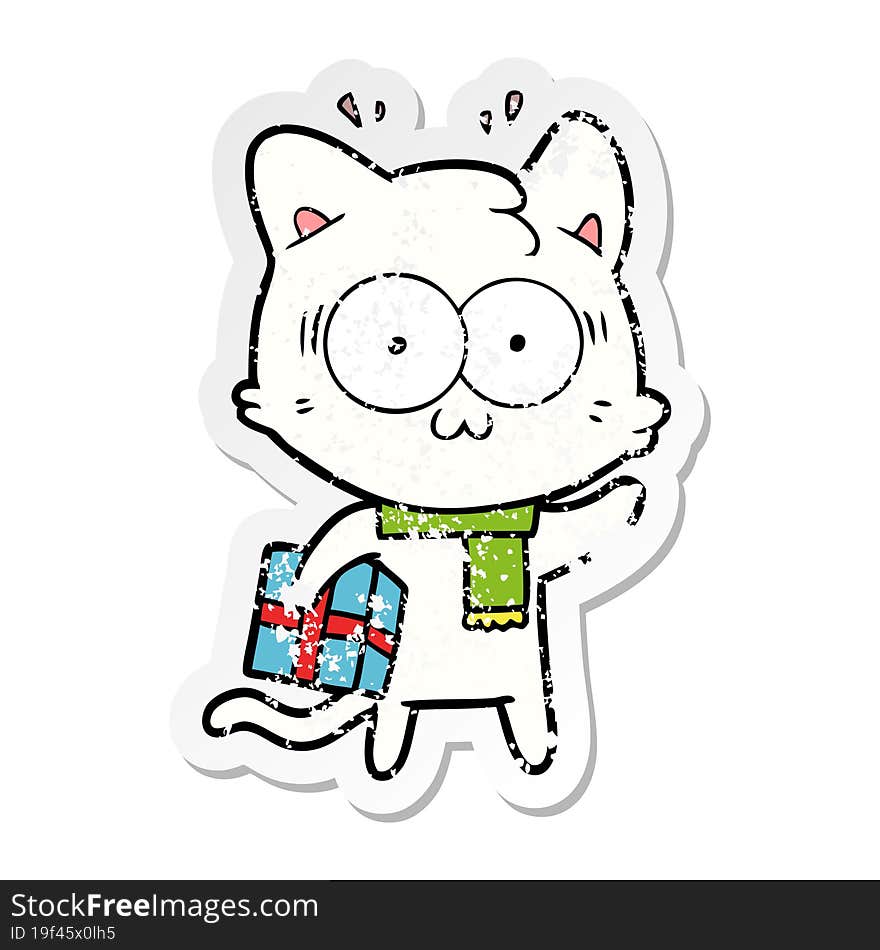 Distressed Sticker Of A Cartoon Surprised Cat With Christmas Present