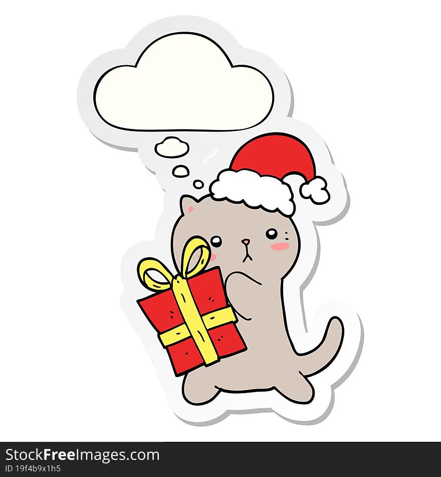 cute cartoon cat carrying christmas present and thought bubble as a printed sticker