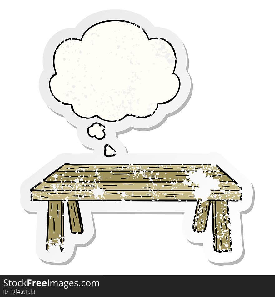 cartoon table and thought bubble as a distressed worn sticker