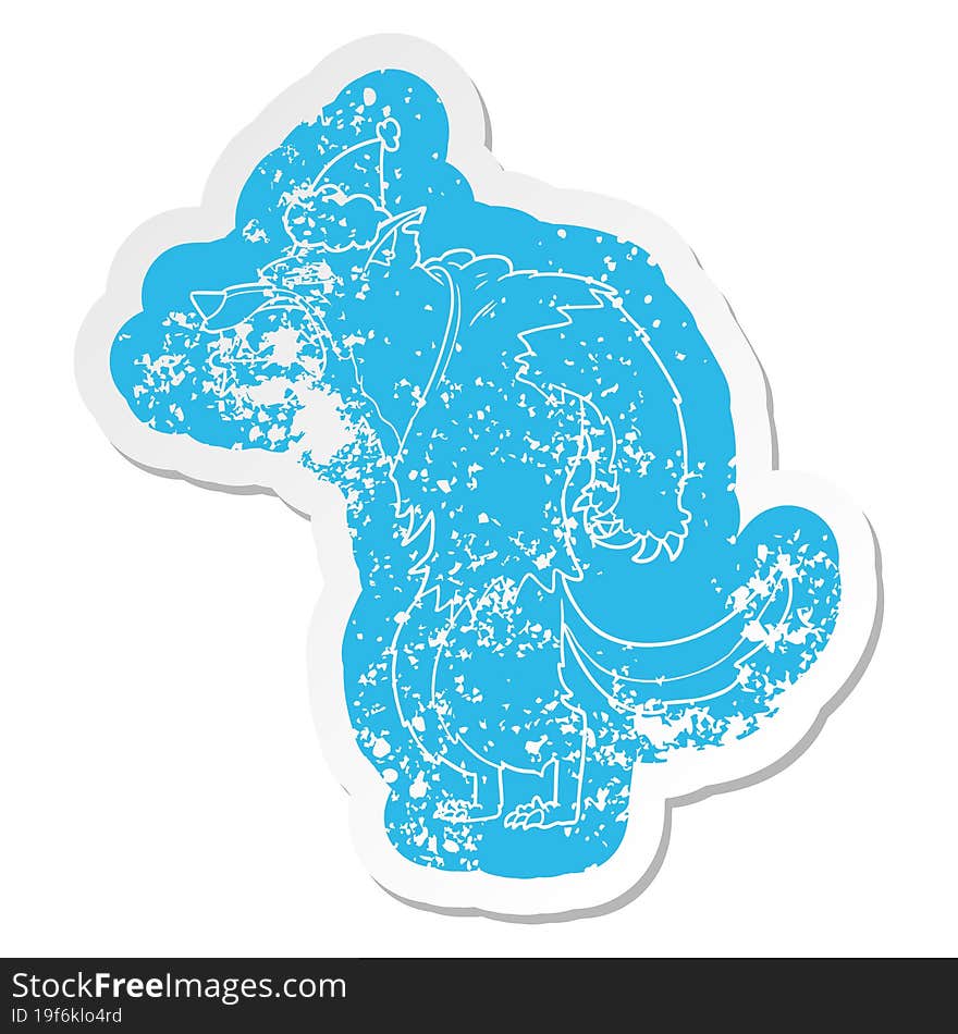 angry werewolf quirky cartoon distressed sticker of a wearing santa hat