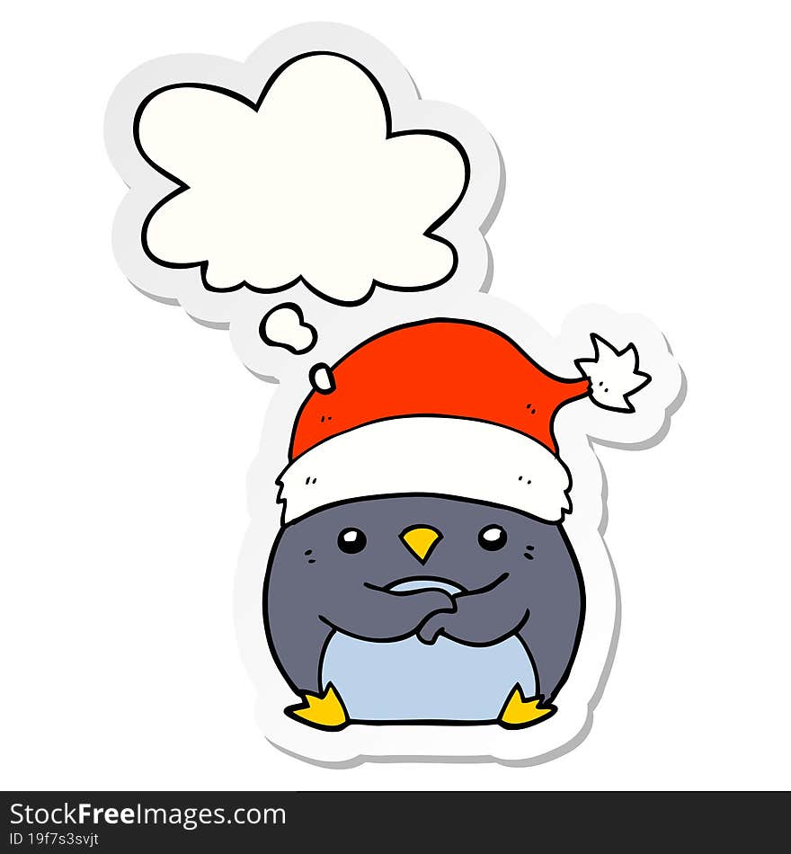 cute cartoon penguin wearing christmas hat and thought bubble as a printed sticker