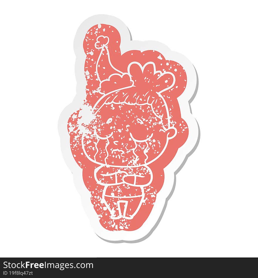 Cartoon Distressed Sticker Of A Crying Woman Wearing Santa Hat