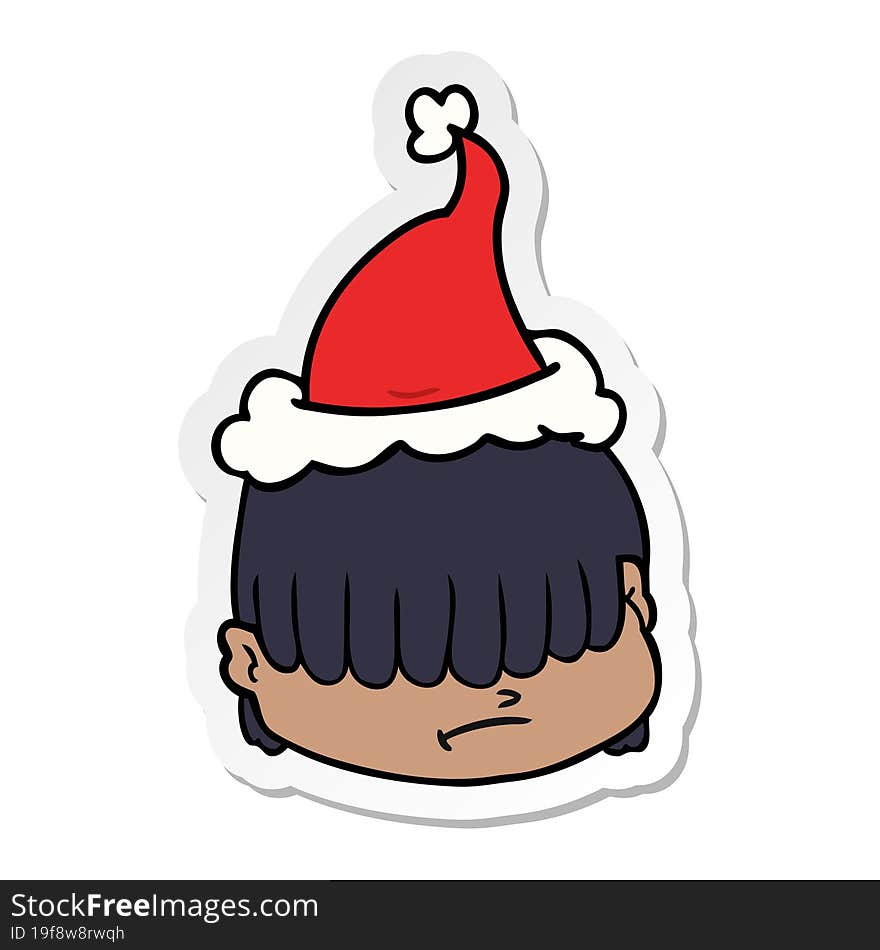 sticker cartoon of a face with hair over eyes wearing santa hat