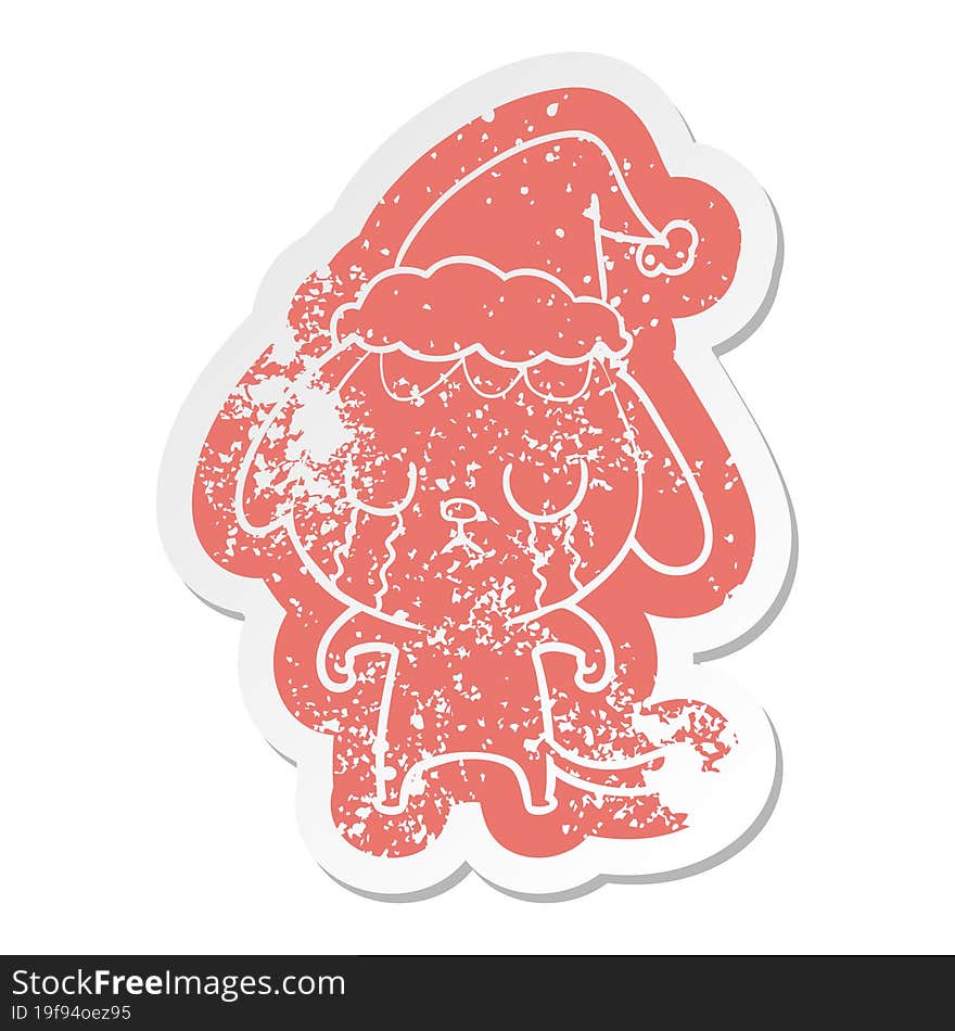 cute quirky cartoon distressed sticker of a dog crying wearing santa hat