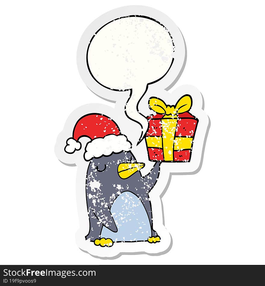 cartoon penguin and christmas present and speech bubble distressed sticker