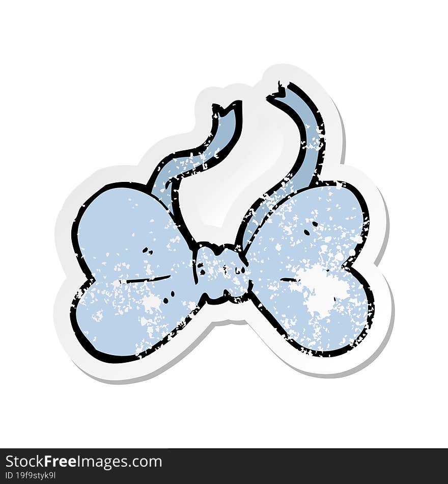 retro distressed sticker of a cartoon bow tie