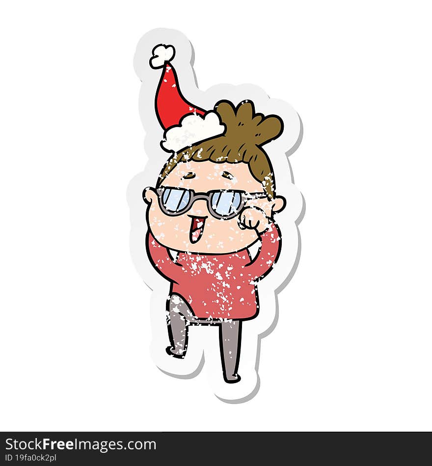 distressed sticker cartoon of a happy woman wearing spectacles wearing santa hat