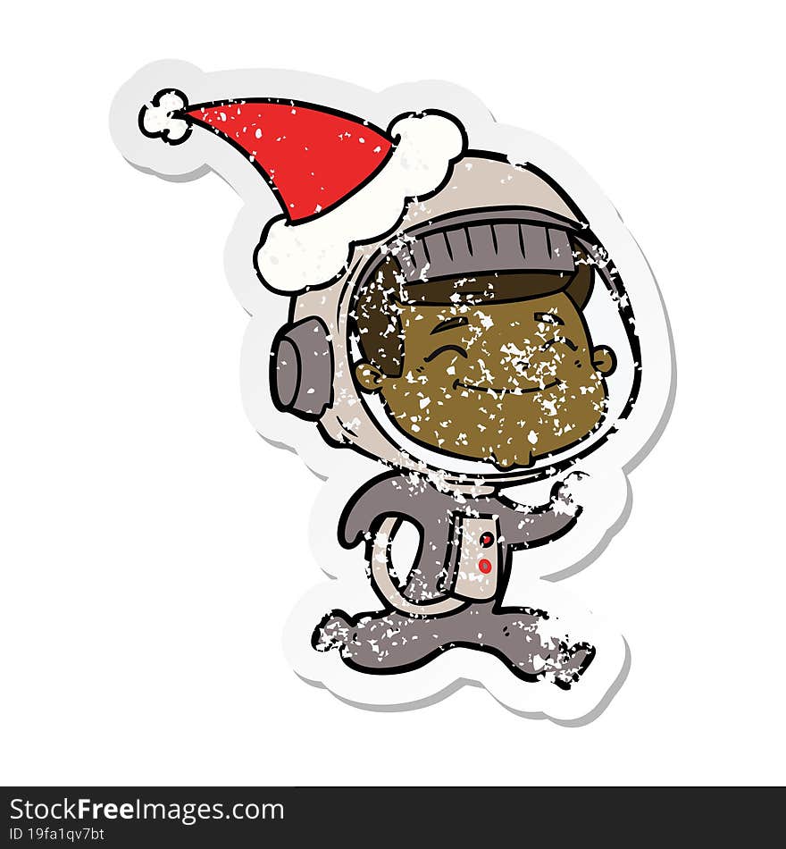 happy hand drawn distressed sticker cartoon of a astronaut wearing santa hat