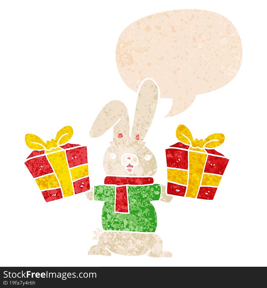 cartoon rabbit with christmas presents with speech bubble in grunge distressed retro textured style. cartoon rabbit with christmas presents with speech bubble in grunge distressed retro textured style