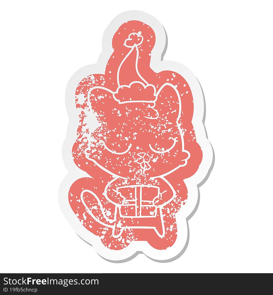 cute cartoon distressed sticker of a cat wearing santa hat