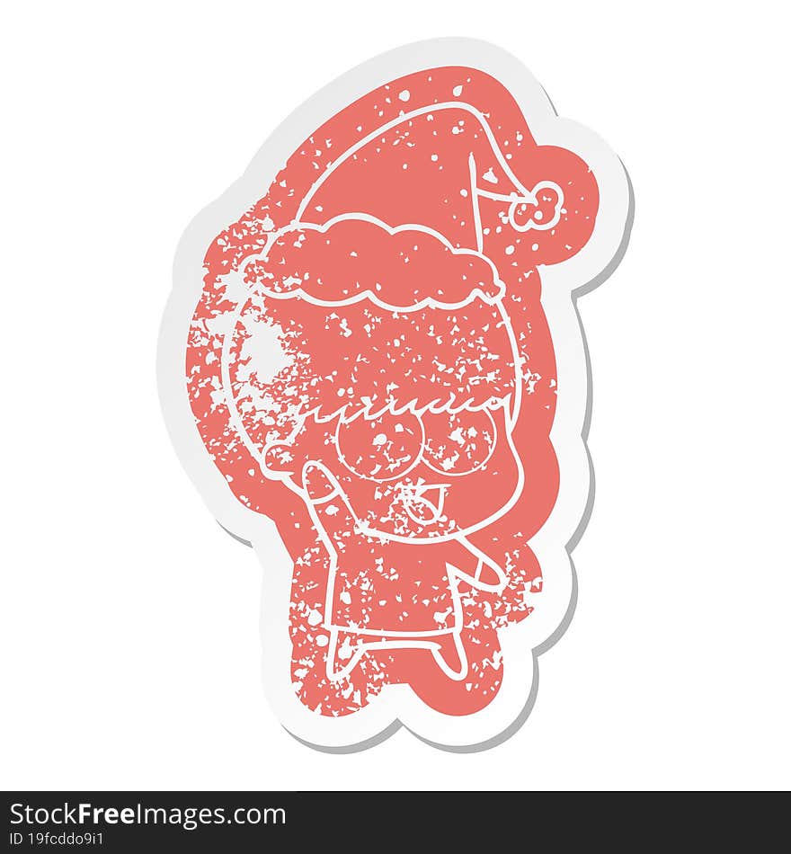 happy quirky cartoon distressed sticker of a boy waving wearing santa hat