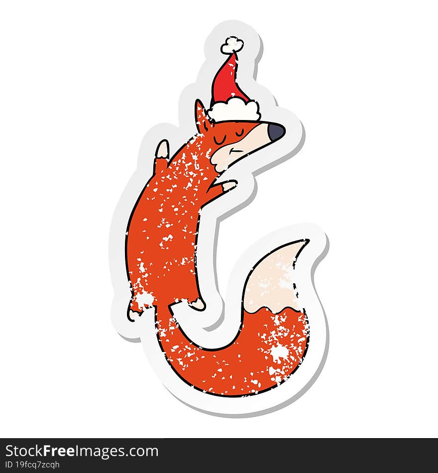 distressed sticker cartoon of a jumping fox wearing santa hat