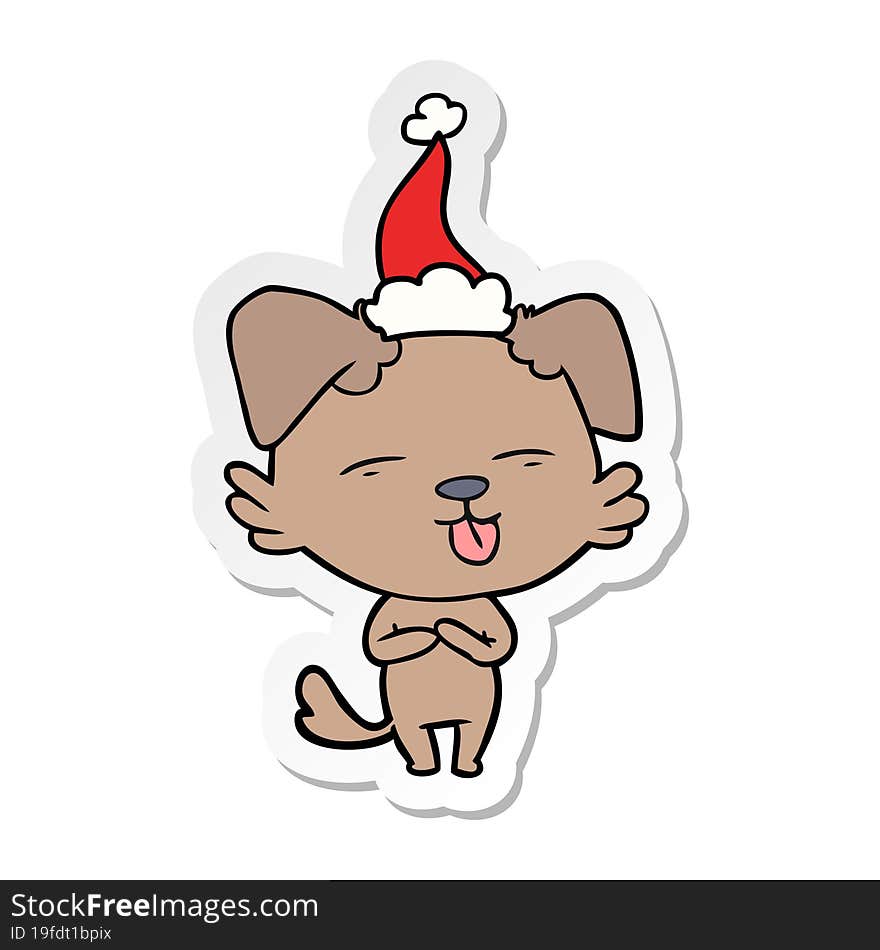 sticker cartoon of a dog sticking out tongue wearing santa hat