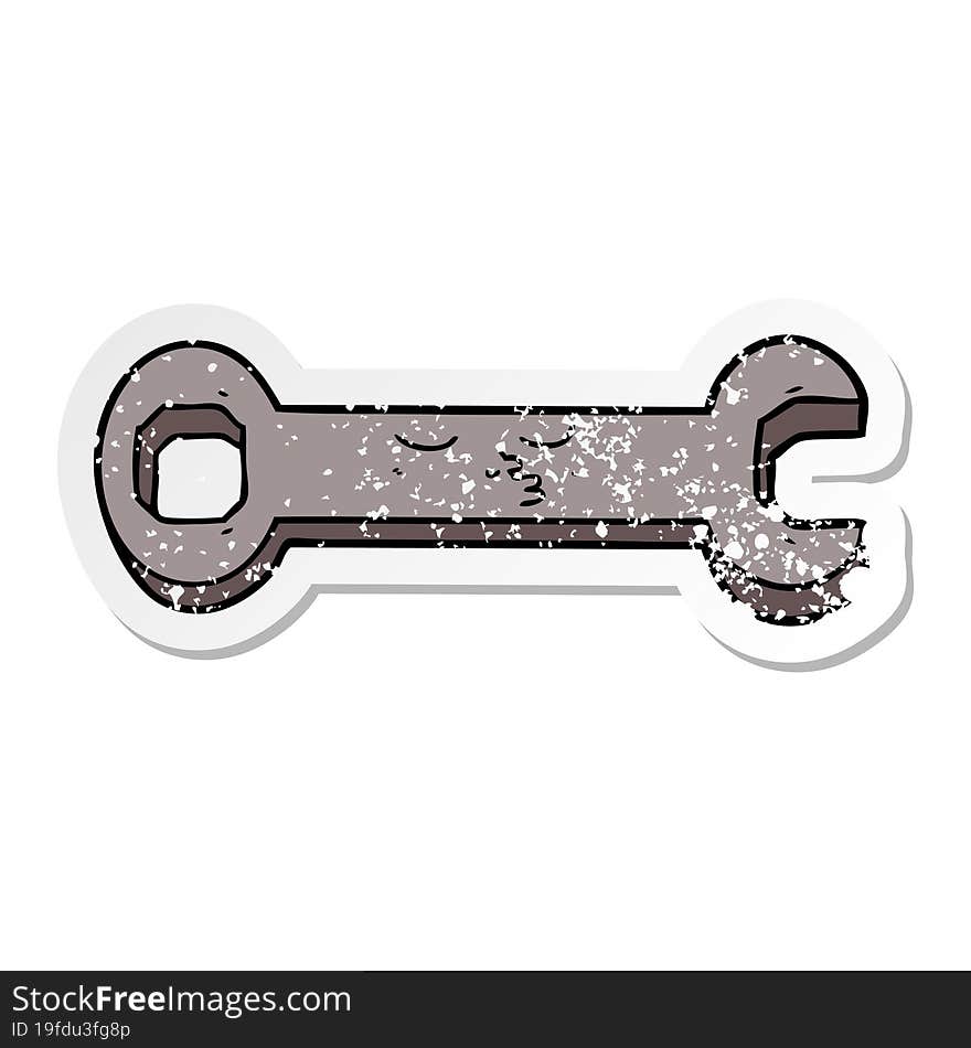 distressed sticker of a cartoon spanner