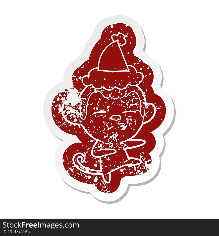 cartoon distressed sticker of a suspicious monkey wearing santa hat