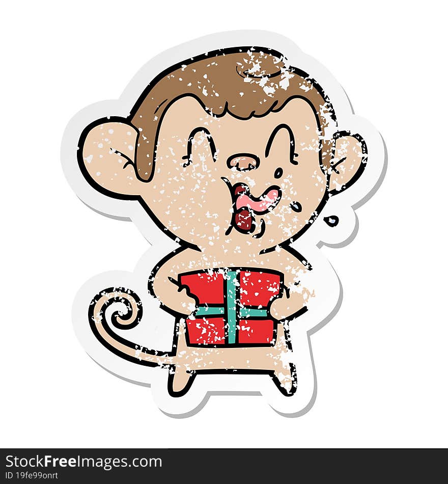 distressed sticker of a crazy cartoon monkey with christmas present