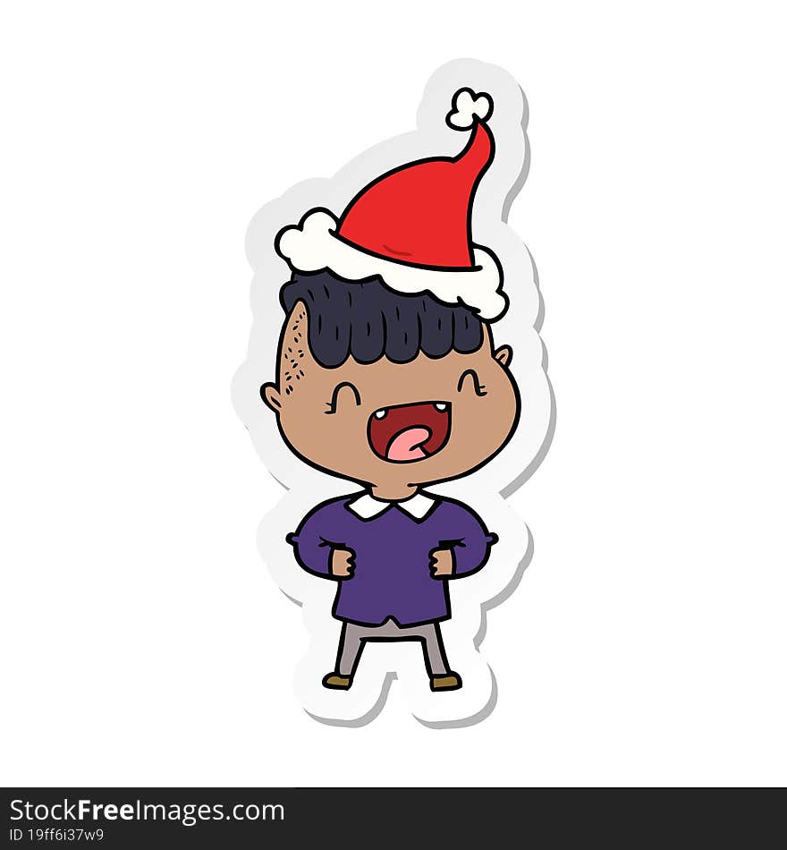 hand drawn sticker cartoon of a happy boy laughing wearing santa hat