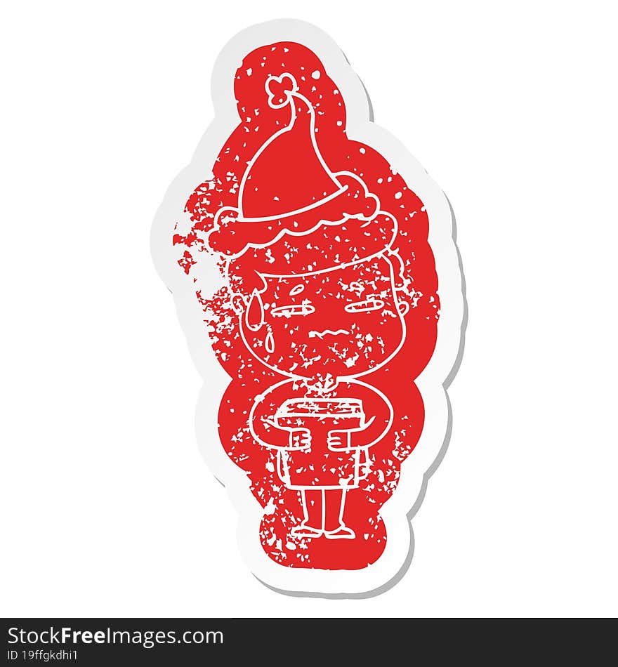 quirky cartoon distressed sticker of a anxious boy carrying book wearing santa hat