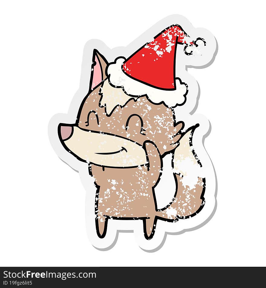 friendly distressed sticker cartoon of a wolf wearing santa hat