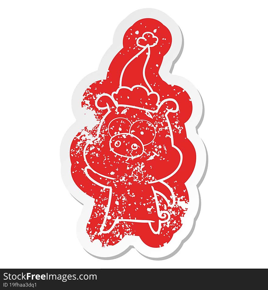 happy cartoon distressed sticker of a pig wearing santa hat