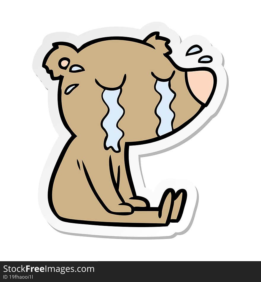 distressed sticker of a cartoon bear crying