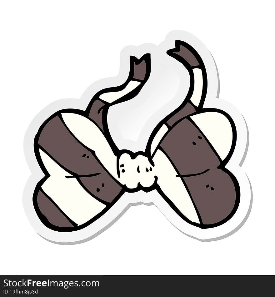 sticker of a cartoon striped bow tie