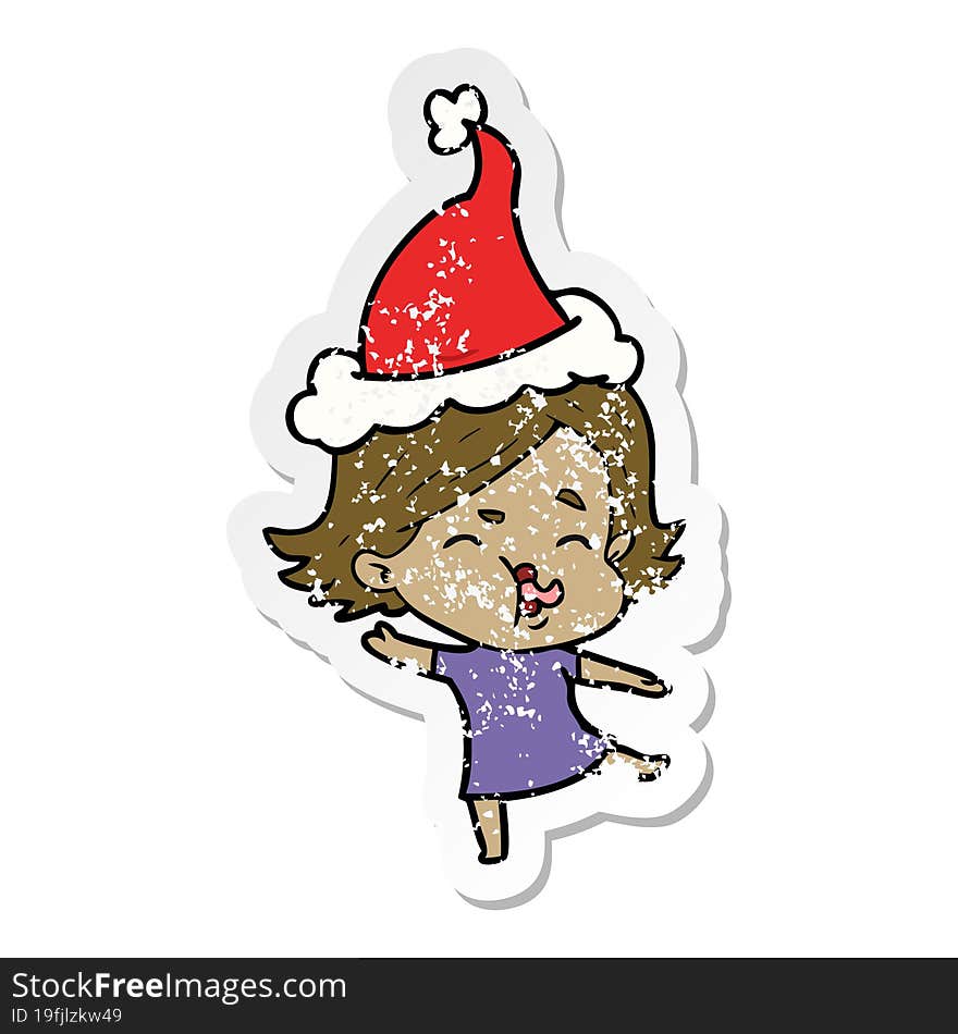 hand drawn distressed sticker cartoon of a girl pulling face wearing santa hat