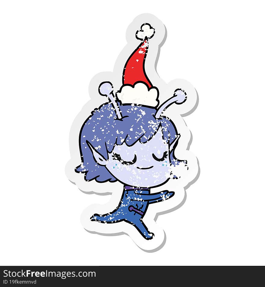 smiling alien girl distressed sticker cartoon of a running wearing santa hat