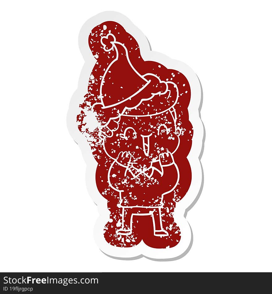 Cartoon Distressed Sticker Of A Laughing Boy Wearing Santa Hat