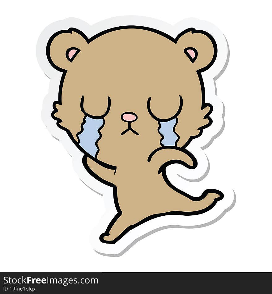 sticker of a crying cartoon bear running away