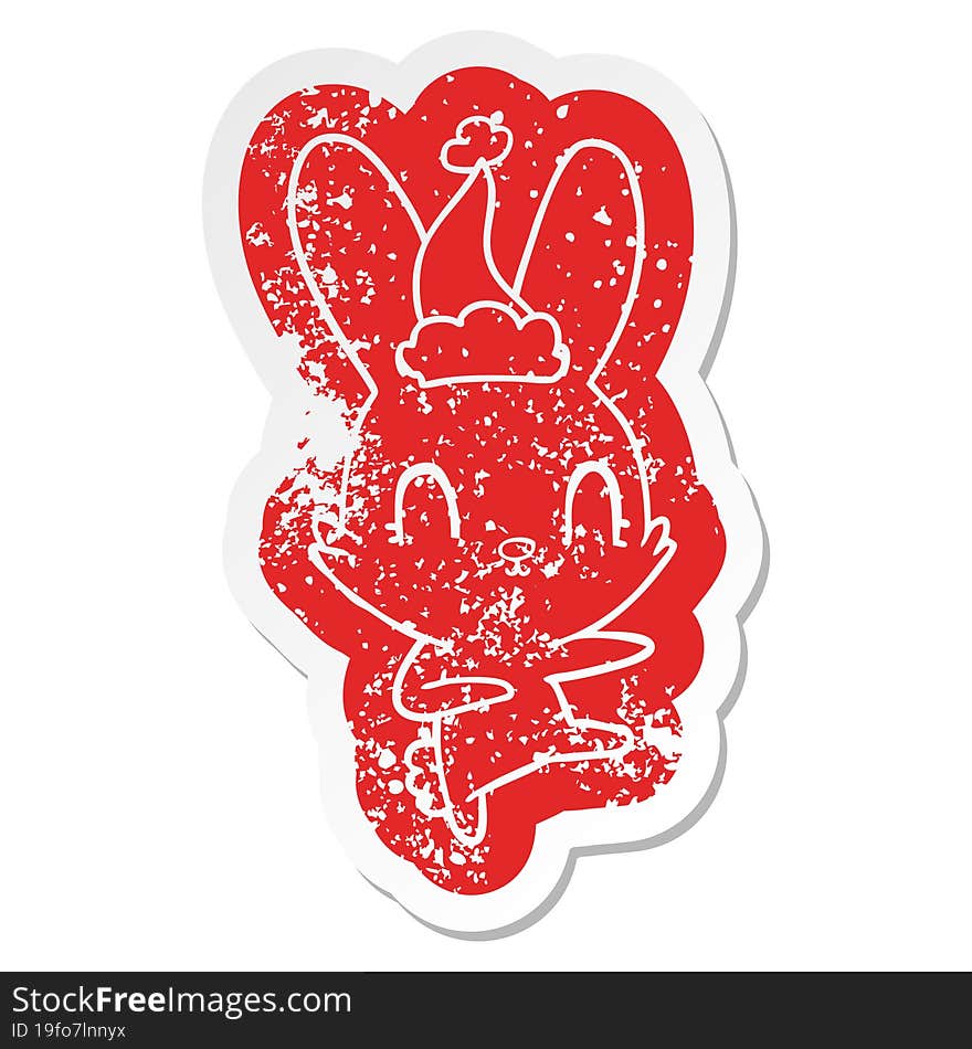 Cute Cartoon Distressed Sticker Of A Rabbit Dancing Wearing Santa Hat