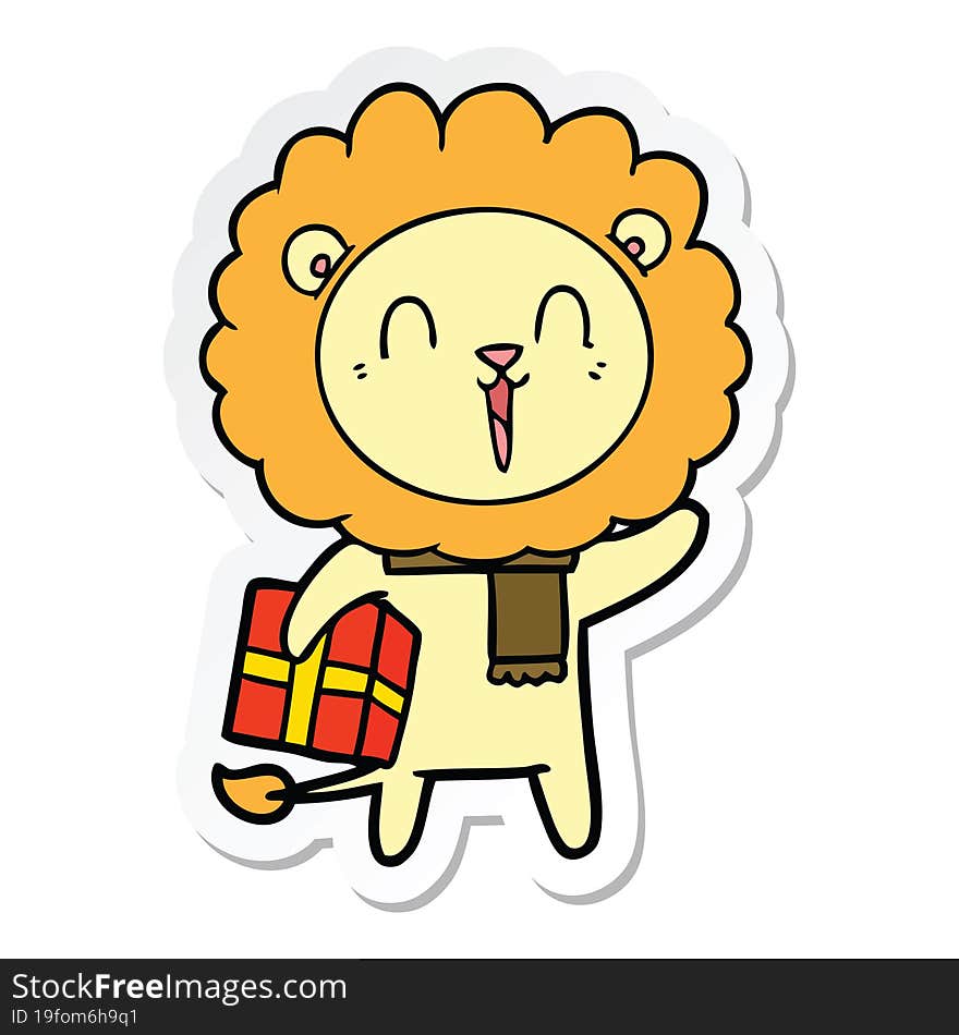 Sticker Of A Laughing Lion Cartoon With Christmas Present