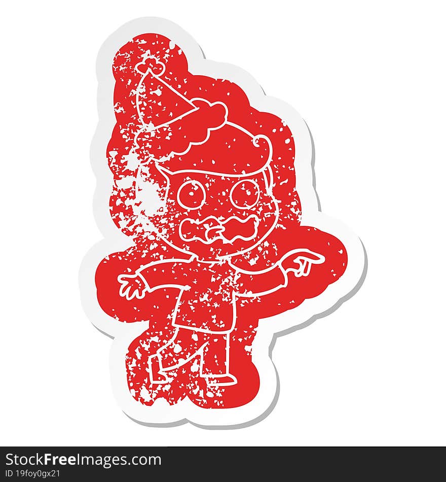 cartoon distressed sticker of a stressed out pointing wearing santa hat