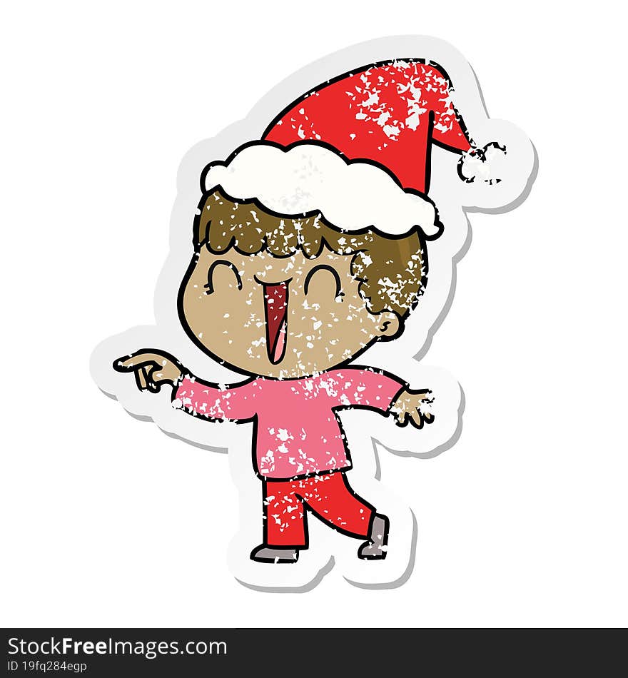 laughing distressed sticker cartoon of a man pointing wearing santa hat