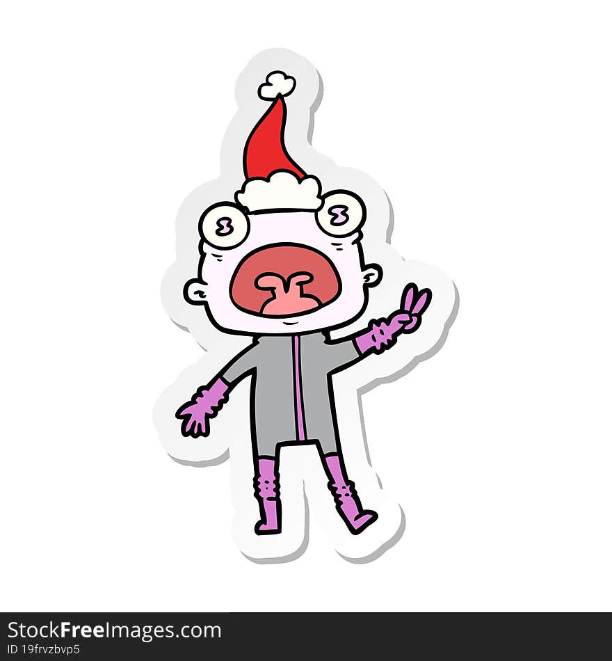 hand drawn sticker cartoon of a weird alien waving wearing santa hat