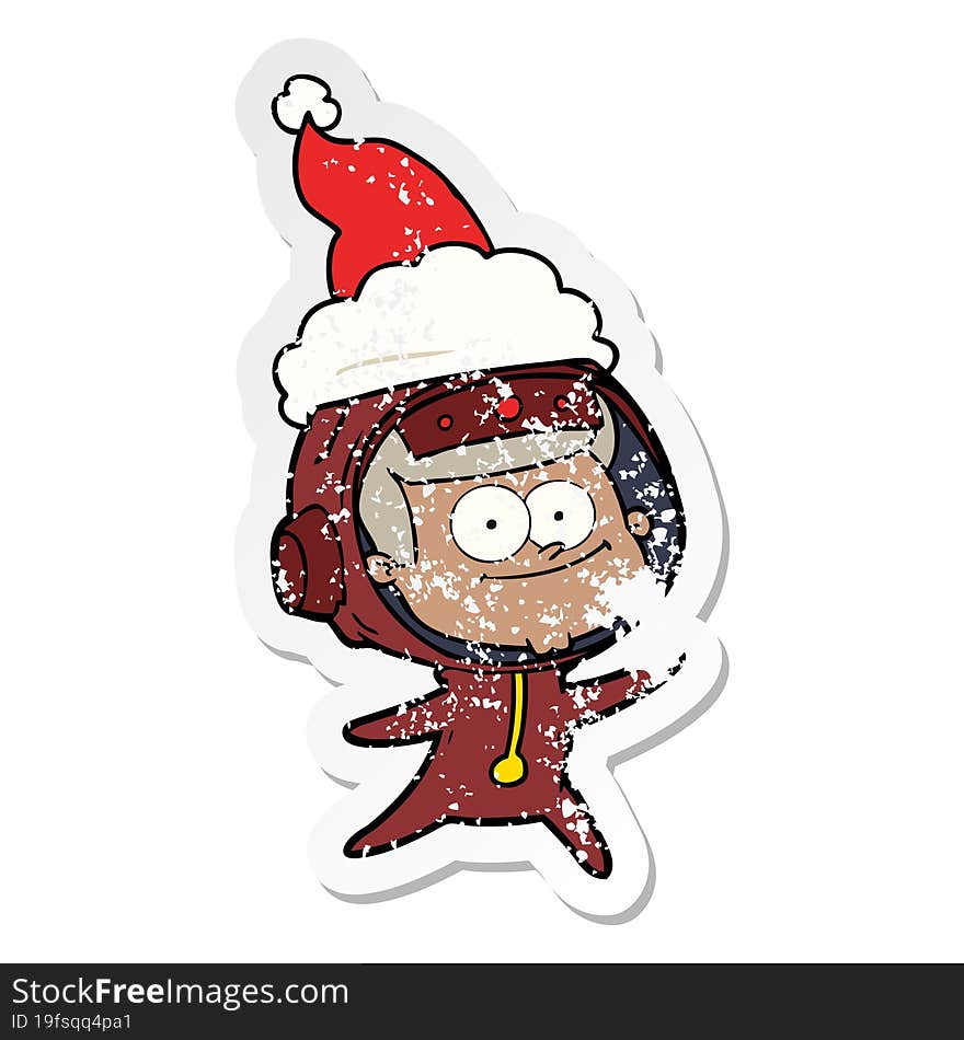 happy astronaut hand drawn distressed sticker cartoon of a wearing santa hat