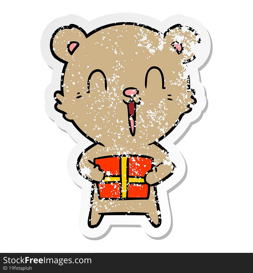 distressed sticker of a happy cartoon bear with christmas gift