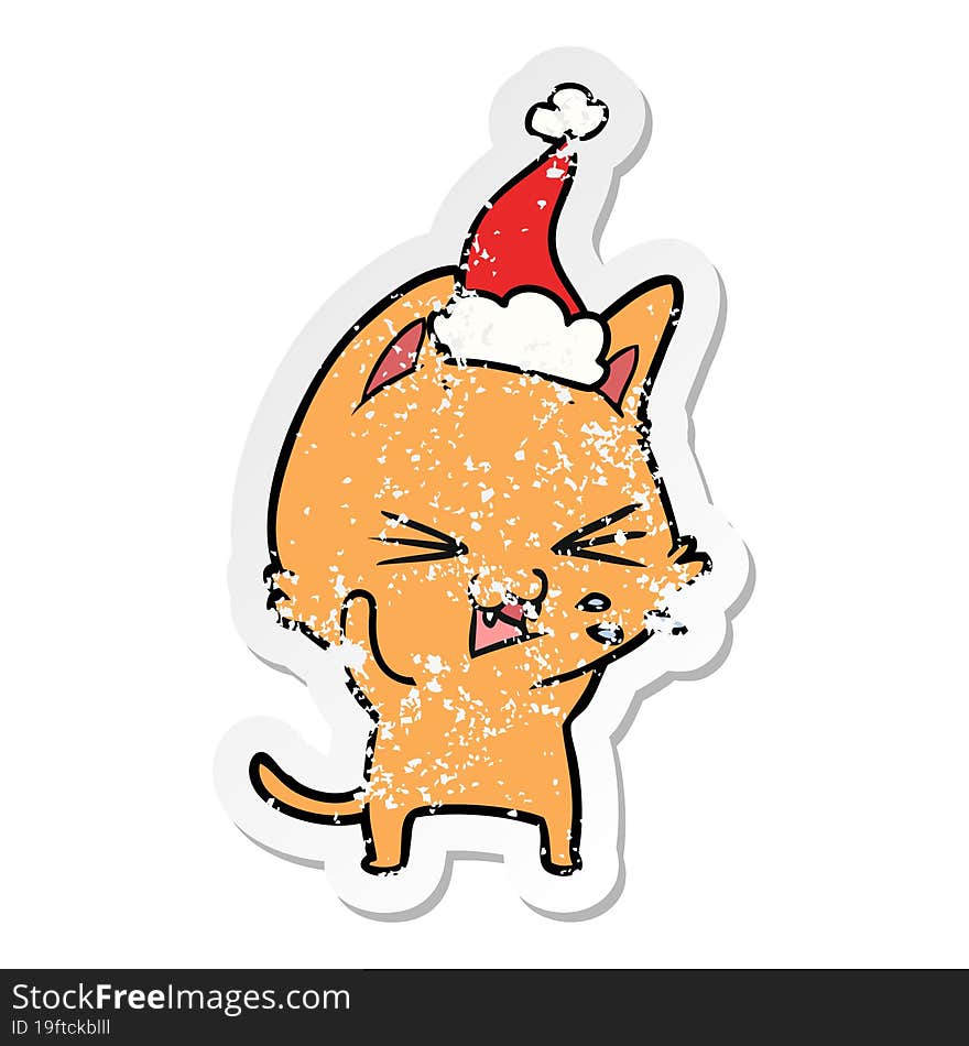 distressed sticker cartoon of a cat hissing wearing santa hat