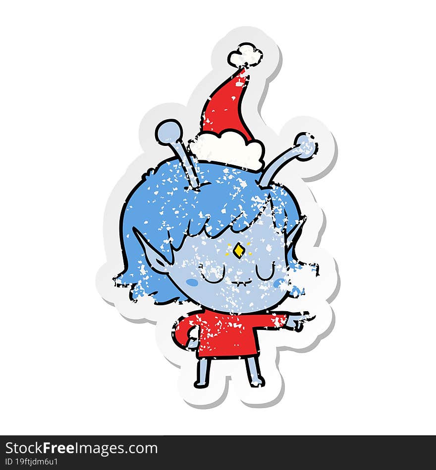 distressed sticker cartoon of a alien girl wearing santa hat