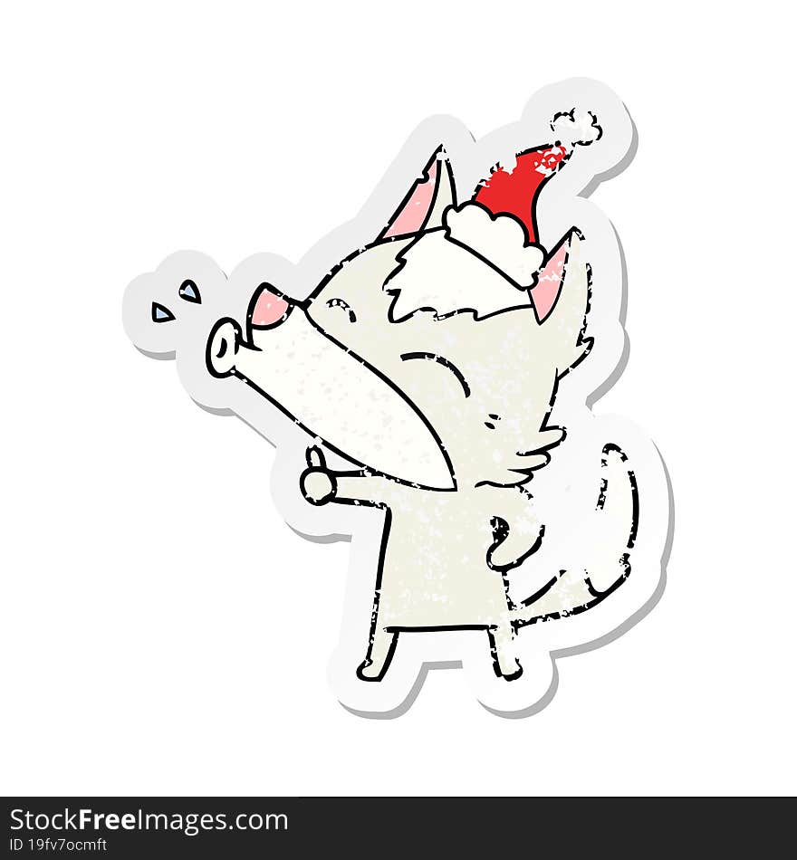 howling wolf distressed sticker cartoon of a wearing santa hat