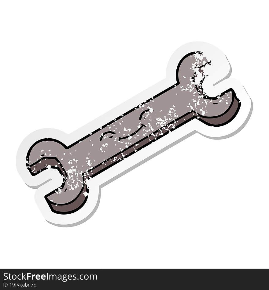 distressed sticker of a cartoon spanner