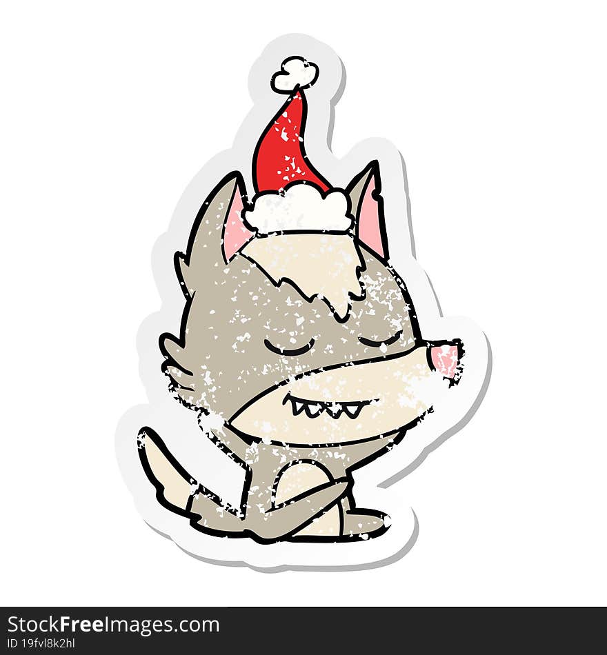 friendly distressed sticker cartoon of a wolf sitting wearing santa hat