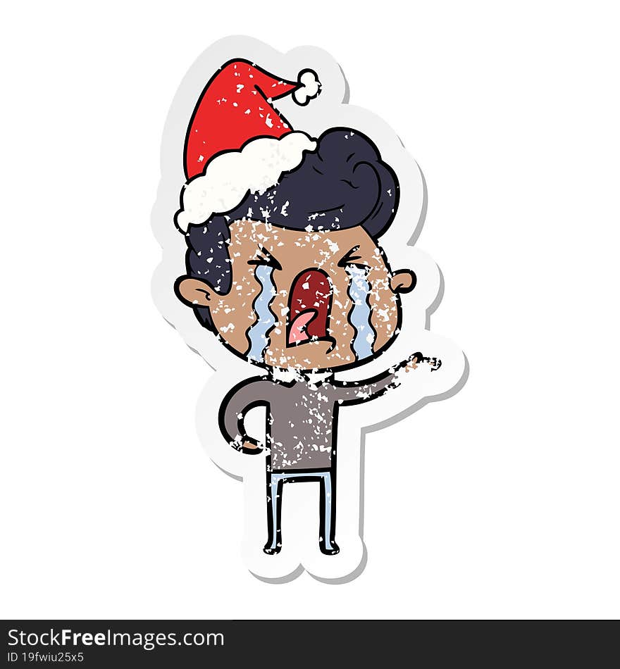 distressed sticker cartoon of a crying man wearing santa hat