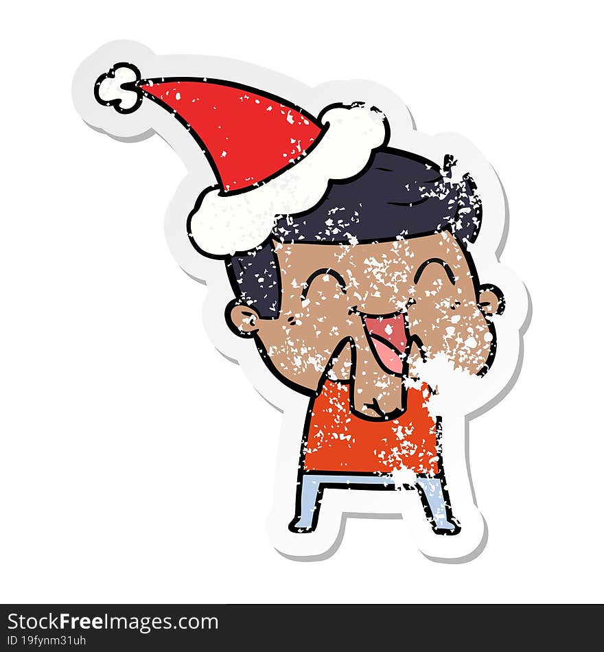 distressed sticker cartoon of a man laughing wearing santa hat