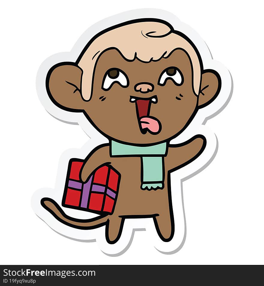 Sticker Of A Crazy Cartoon Monkey With Christmas Present