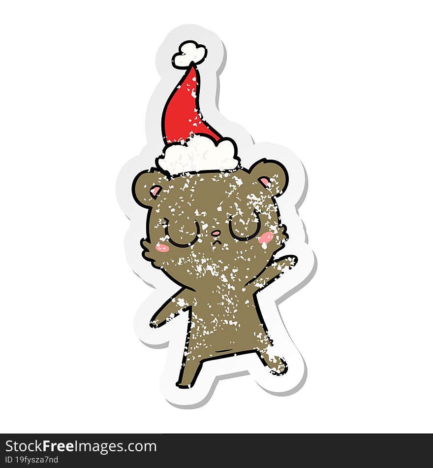 peaceful distressed sticker cartoon of a bear wearing santa hat