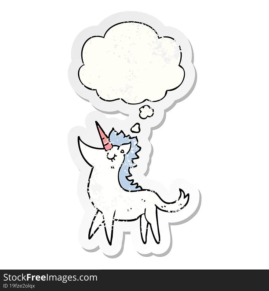 cartoon unicorn and thought bubble as a distressed worn sticker