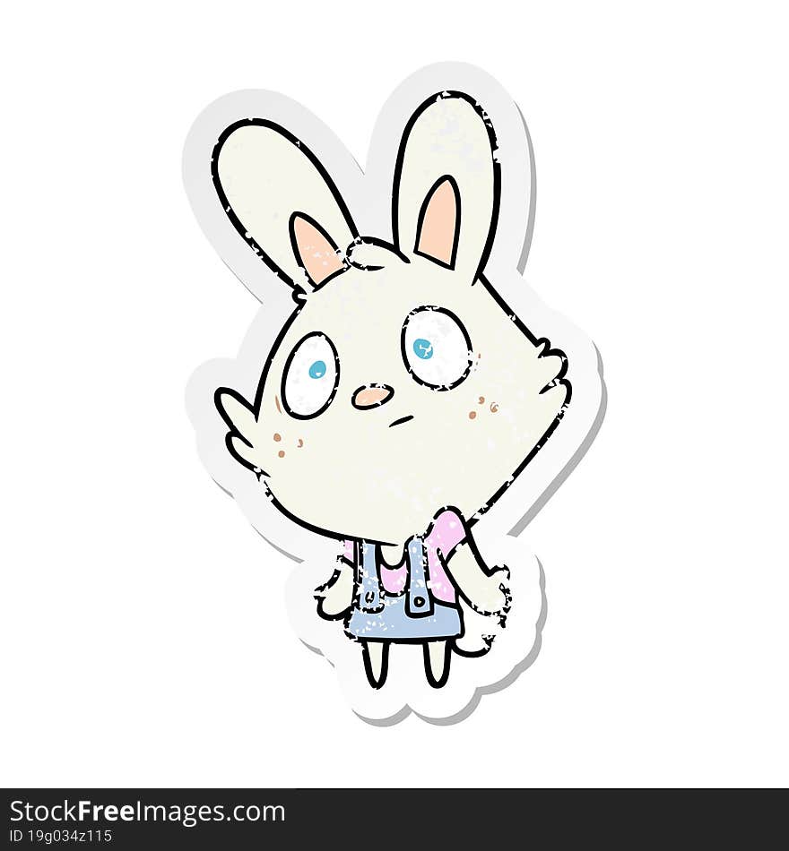 distressed sticker of a cartoon rabbit shrugging shoulders