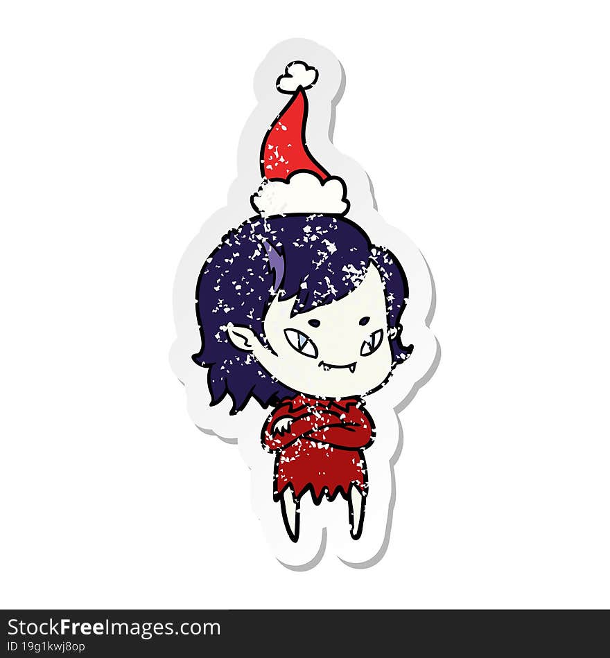 distressed sticker cartoon of a friendly vampire girl wearing santa hat